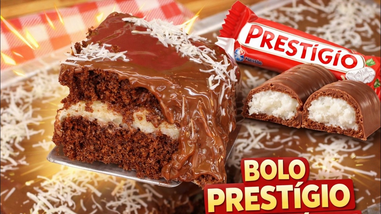 Bolo Prestígio caseiro com cobertura de chocolate e recheio de coco cremoso